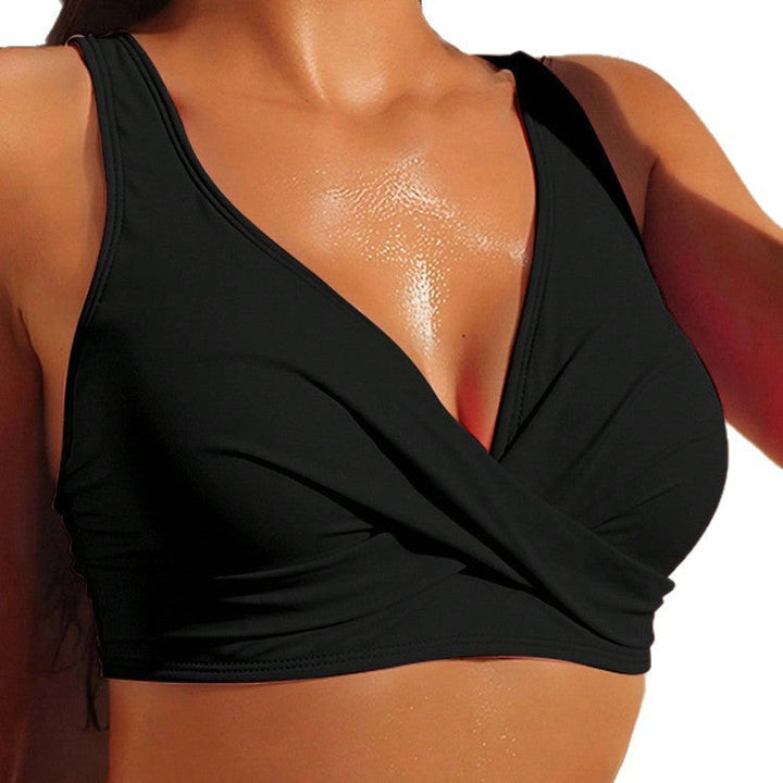 Mjuk svart dam crop-top för träning & fitness. Justerbara axelremmar för optimal komfort under yoga & gym.