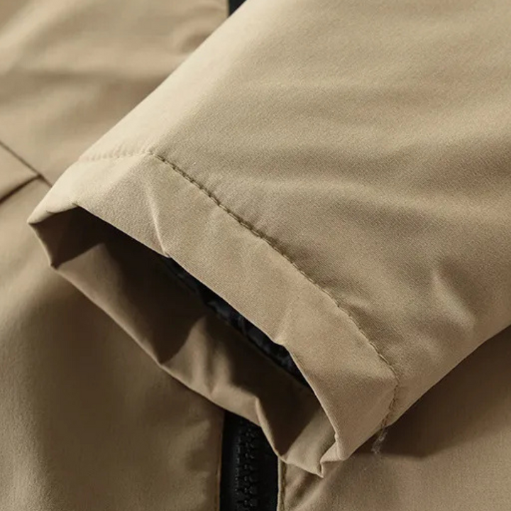 Grå vinterjacka herr, mysig och modern parkas. Varmt ytterplagg för stilmedvetna män.