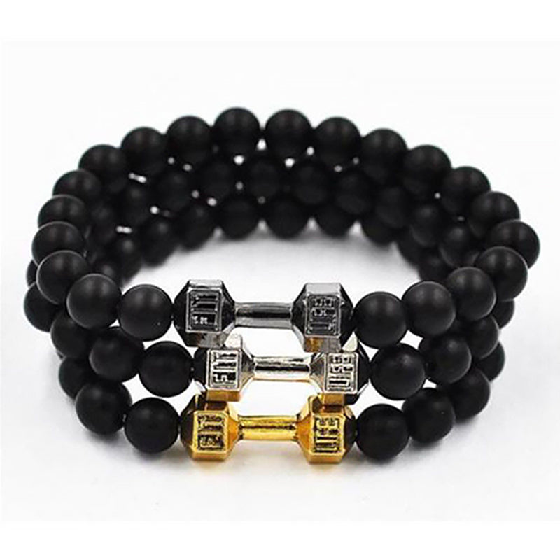 "Svart unisex hantelarmband i onyx och lavasten för chakra, elegant design, naturliga stenar, accessoar för energi och stil."