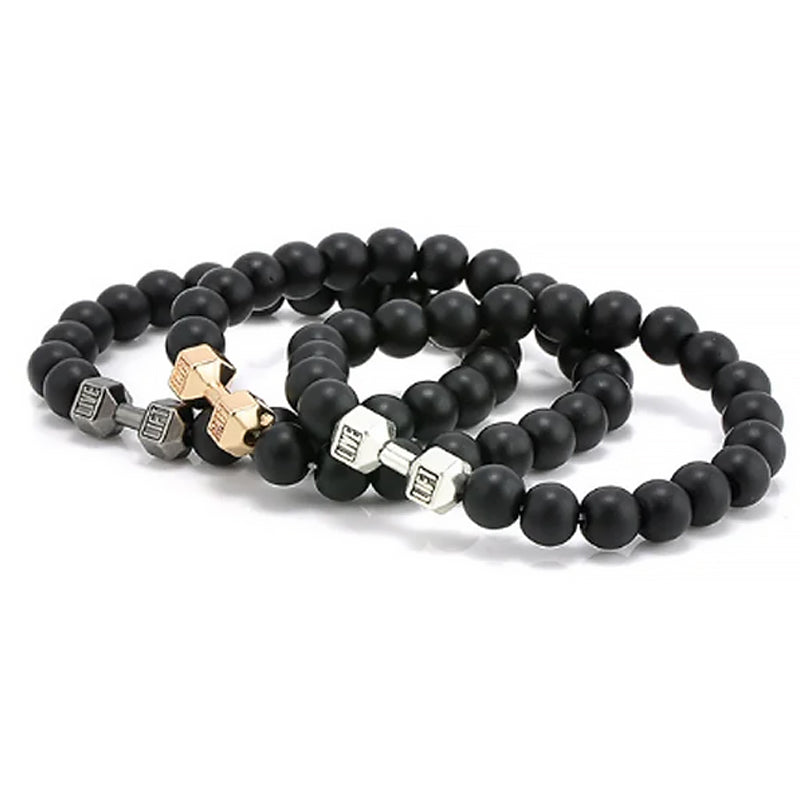 "Svart unisex hantelarmband i onyx och lavasten för chakra, elegant design, naturliga stenar, accessoar för energi och stil."