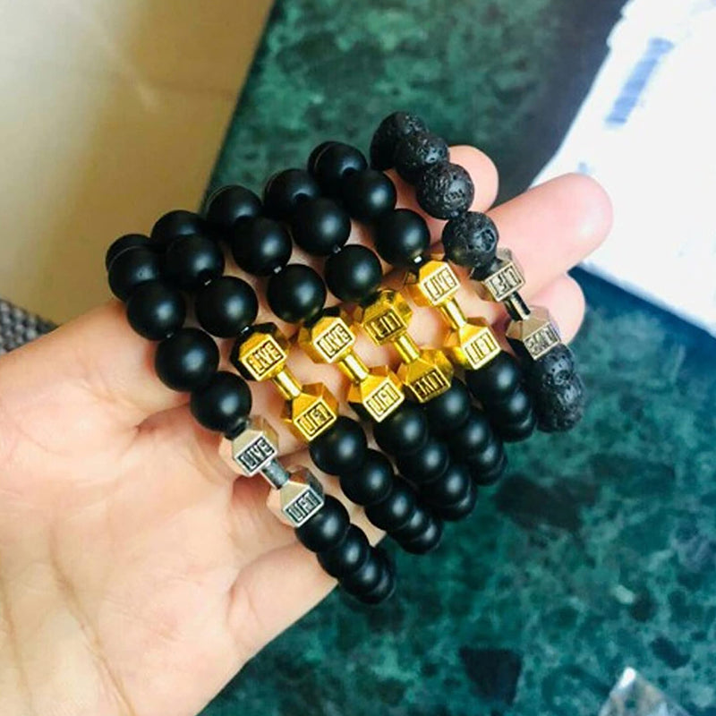 "Svart unisex hantelarmband i onyx och lavasten för chakra, elegant design, naturliga stenar, accessoar för energi och stil."