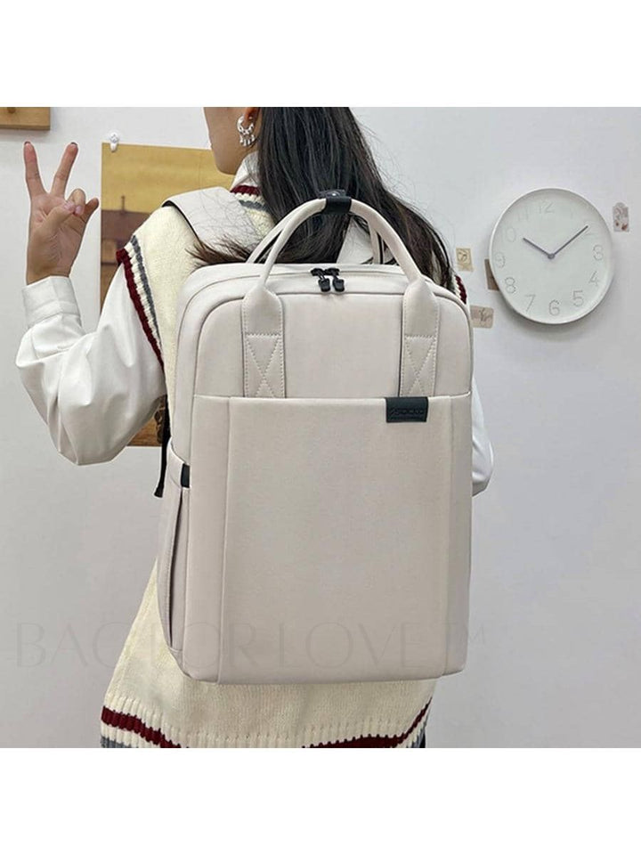 Korallrosa vattentät laptopryggsäck med smarta fack, designad för pendling till skolan.