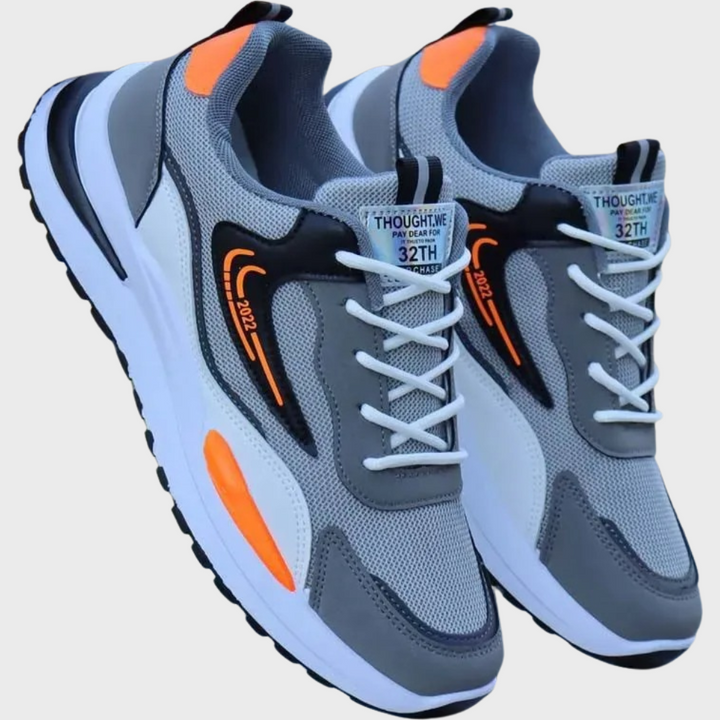 Moderna svarta/grå herrskor. Bekväma, andningsbara sneakers med stilren design för aktiv fritid.