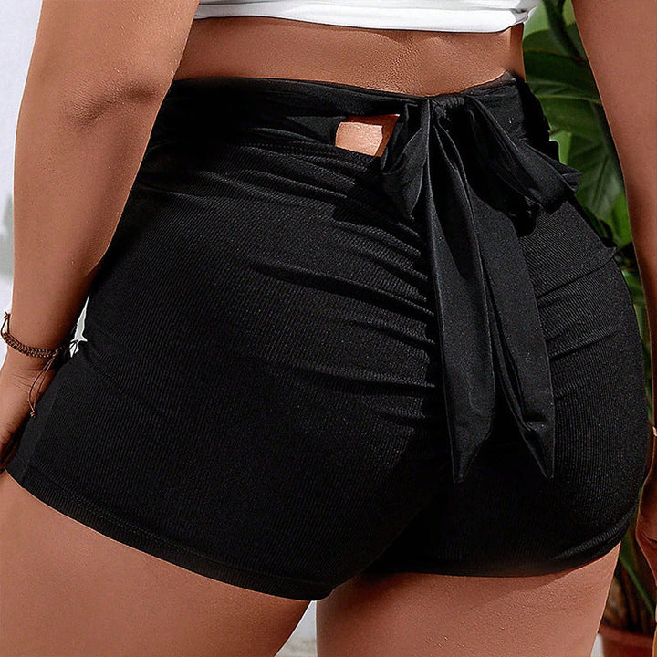 Lätta, snabbtorkande dambadshorts med bekväm elastisk midja och fickor, idealiska för varma klimat.