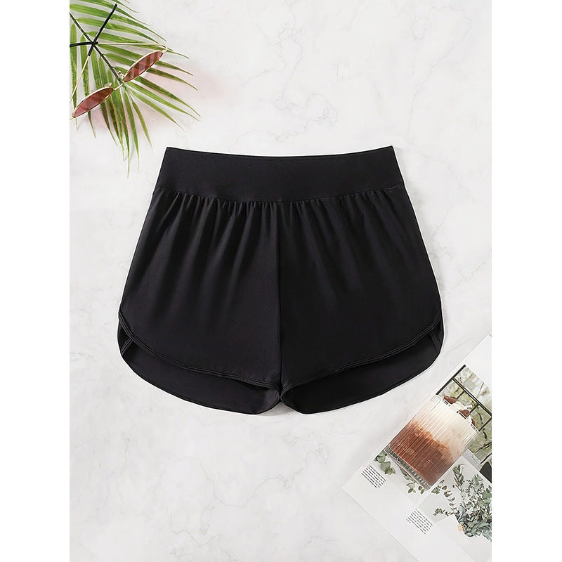 Kvinnors sportshorts med hög midja, lösa och luftiga för maximal rörelsefrihet. Svarta, perfekta för träning.