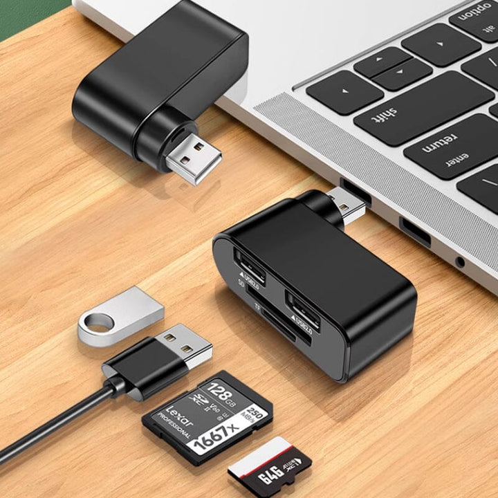 Svart och vit roterbar 4-portars USB-hubb för datorer och surfplattor, ger enkel anslutning och 180 graders rotation.
