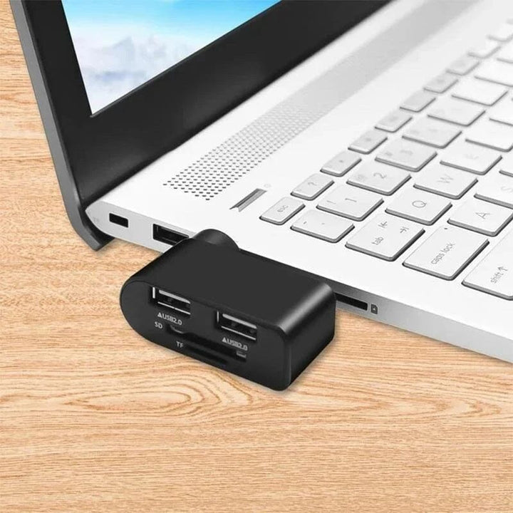 Svart och vit roterbar 4-portars USB-hubb för datorer och surfplattor, ger enkel anslutning och 180 graders rotation.