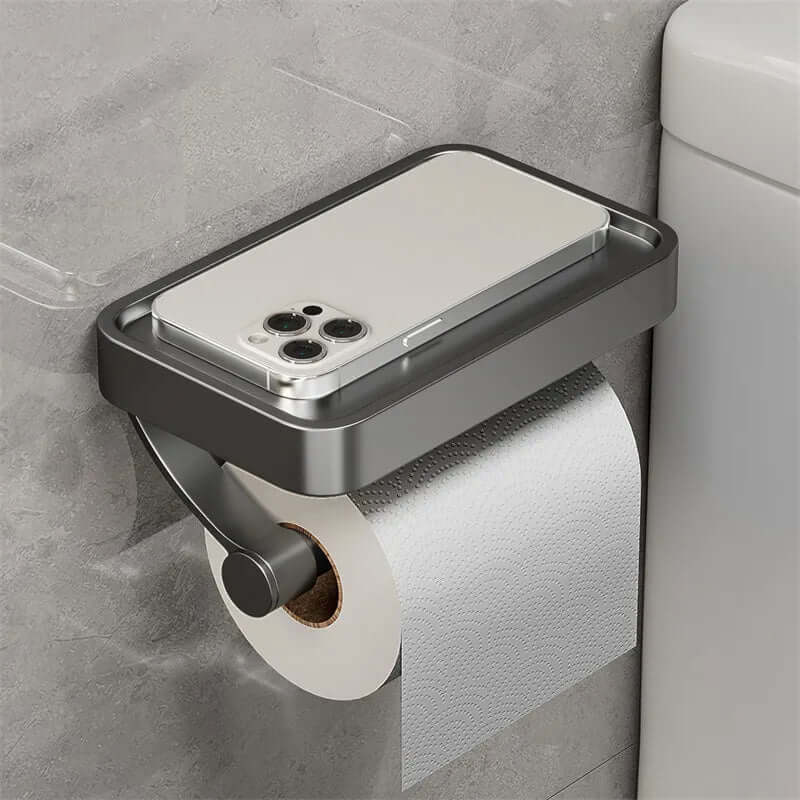 Wc-tillbehör i metall med praktisk avlastningsyta för småsaker