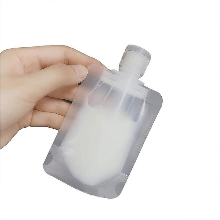 "Transparent påfyllningsbara reseflaskor set, kompakt design för schampo och duschgel, miljövänligt material."
