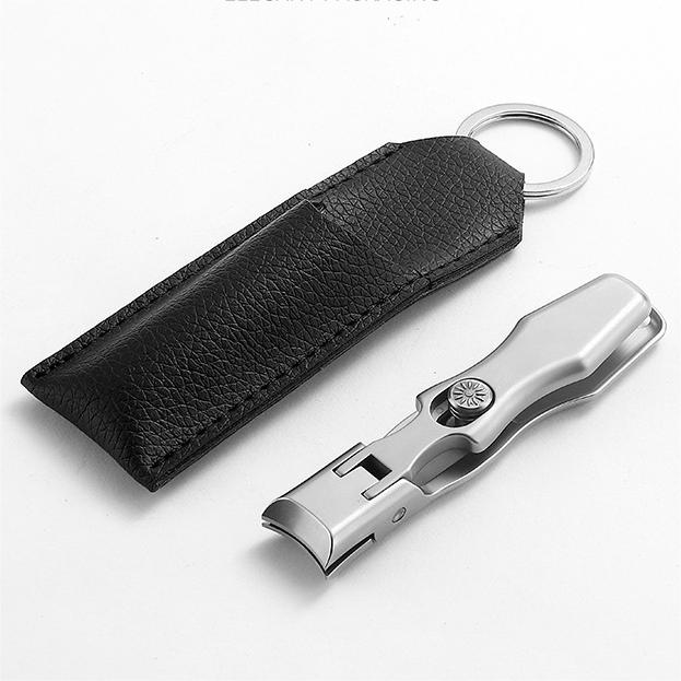 Ultraskarp nagelklippare i rostfritt stål med modern design, effektiv för tjocka naglar, svart och silverfärg, 9x1.6 cm.