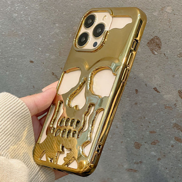 "Unikt dödskalleskal för iPhone med elegant plätering, erbjuder stilfullt skydd och trendig telefontillbehörsdesign."