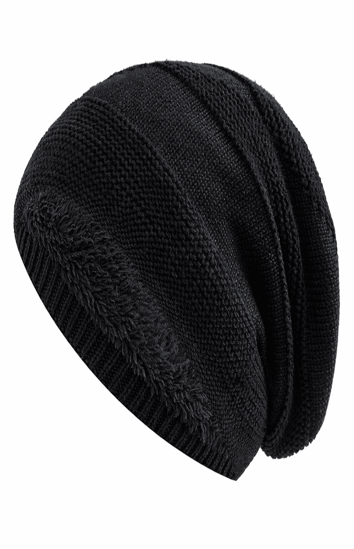Varm stickad mössa med slouchy passform, bekväm unisex accessoar för kalla väder.