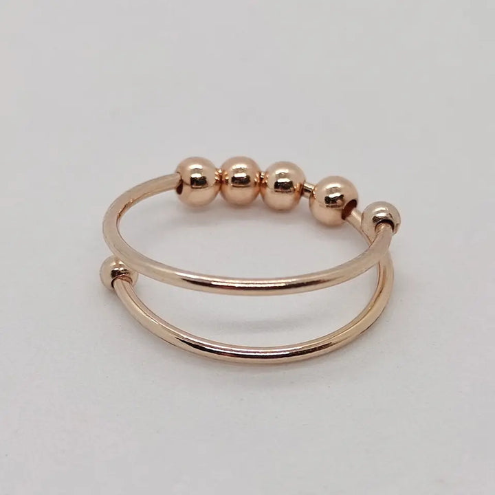 Roséguld Serena stresslindrande ring, justerbar för vardagsbruk. Hjälper mot ångest och ger lugn.