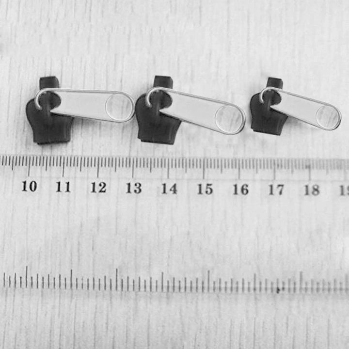 "Unisex Blixtlåsguide Fixkit med olika storlekar för reparation av dragkedjor, visas i olika nyanser och material."
