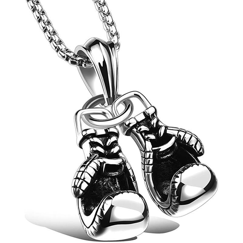 "Unisex boxhandskar halsband i ett glänsande guldigt titanstål, symboliserar styrka och stil för boxningsentusiaster."
