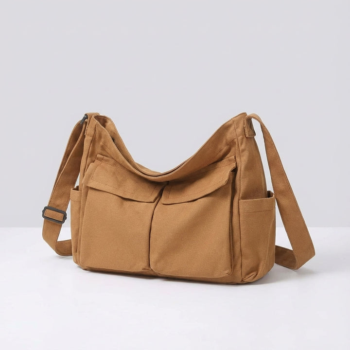 Vit canvas crossbodyväska, perfekt för vardagsbruk med många fack för mobil och nycklar, unisex.