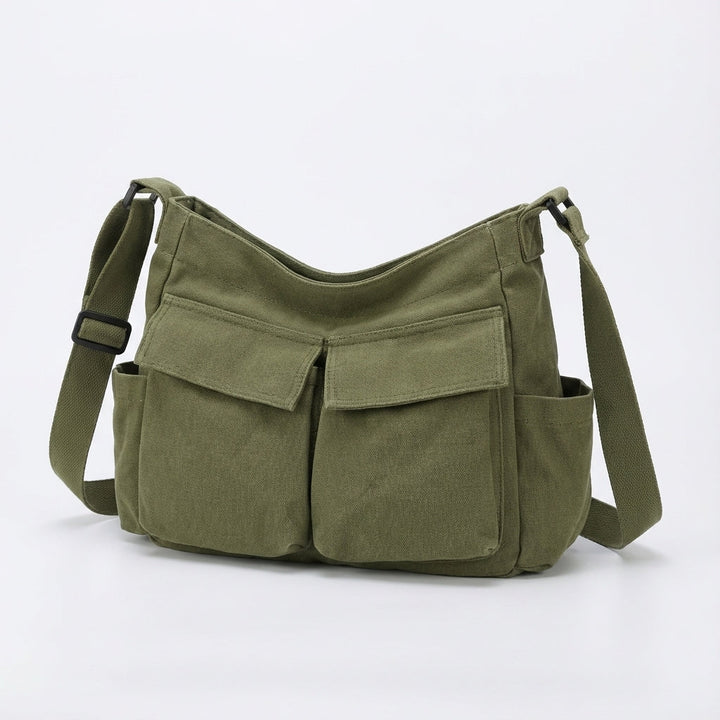 Mångsidig canvasväska, unisex crossbody-modell med slitstark design och flera fack för optimal organisering.