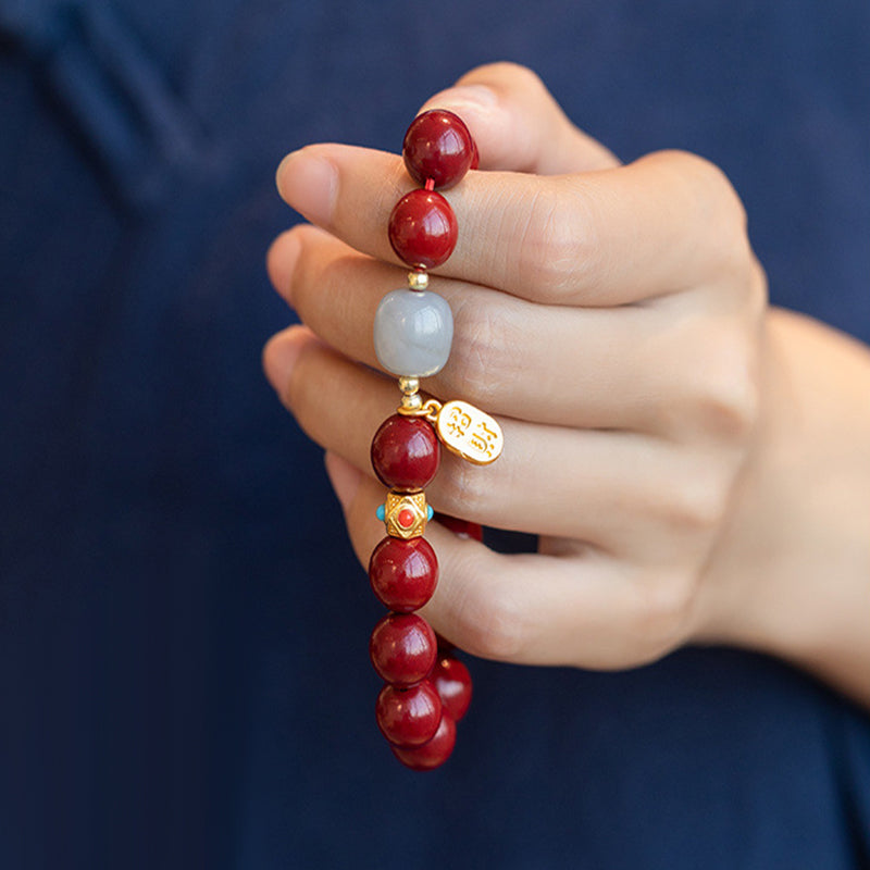 Unisex cinnoberarmband i röd jaspis med släta pärlor, eleganta och jordnära smycken för vardagsbruk.