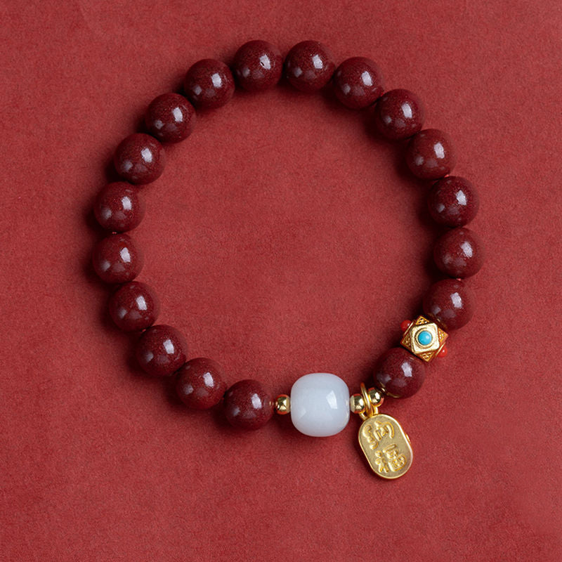 Unisex cinnoberarmband i röd jaspis med släta pärlor, eleganta och jordnära smycken för vardagsbruk.