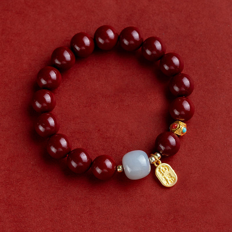 Unisex cinnoberarmband i röd jaspis med släta pärlor, eleganta och jordnära smycken för vardagsbruk.
