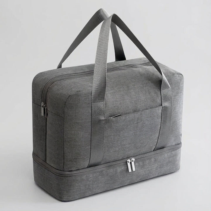 Mörkgrå unisex resväska, Stowport, designad som kabinbagage med skofack för smidiga och organiserade resor.