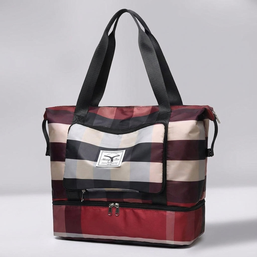 Handbagage-vänlig unisex duffelväska med organiserat bottenfack. Perfekt för sport och weekendresor.