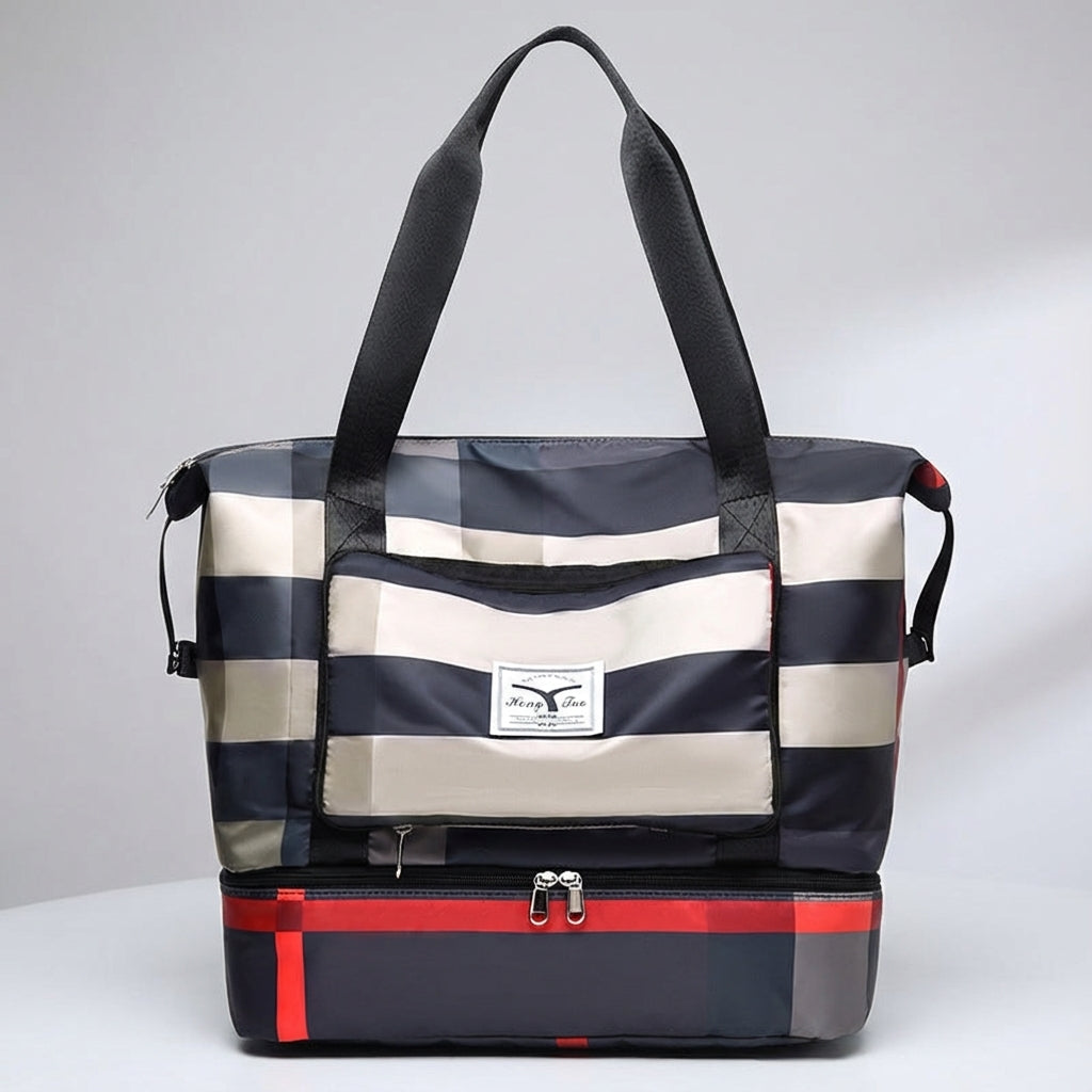 Mångsidig unisex weekendväska med funktionellt bottenfack. För packning till både sport och resa.