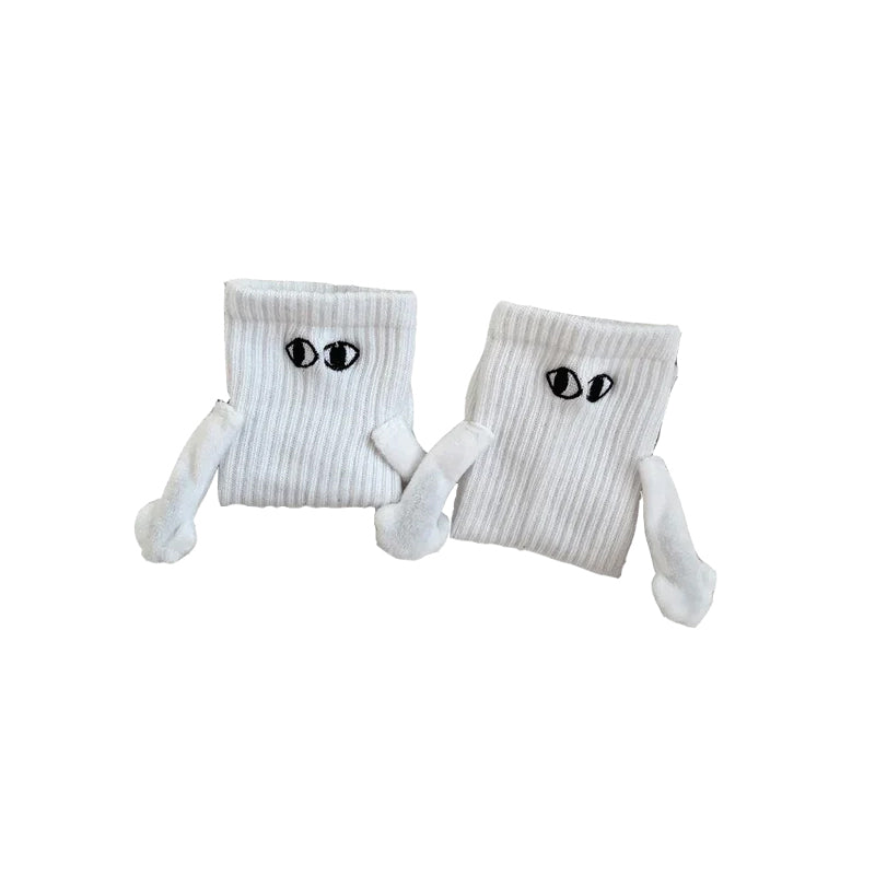 "Unisex strumpor i polyester med magnetiska händer i svart eller vitt, symboliserar kärlek och samhörighet, accessoar."