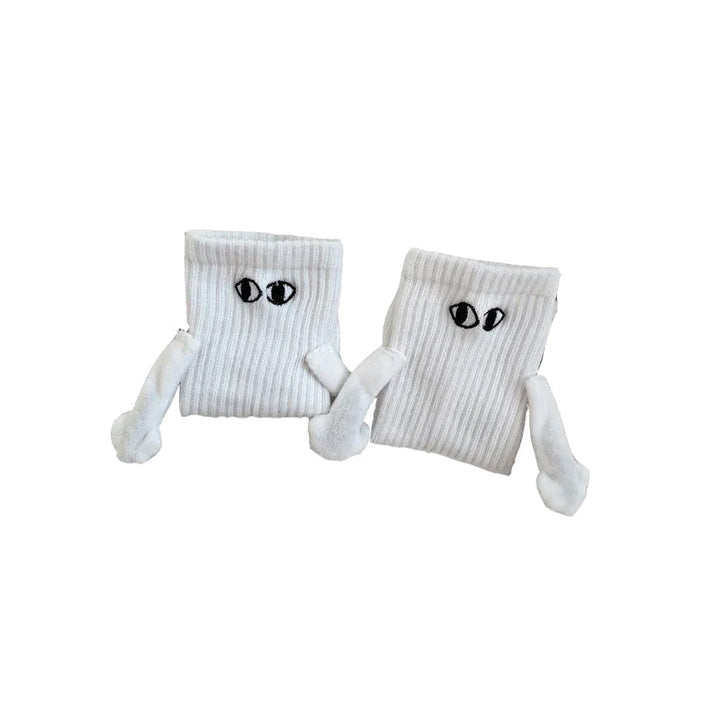 "Unisex strumpor i polyester med magnetiska händer i svart eller vitt, symboliserar kärlek och samhörighet, accessoar."