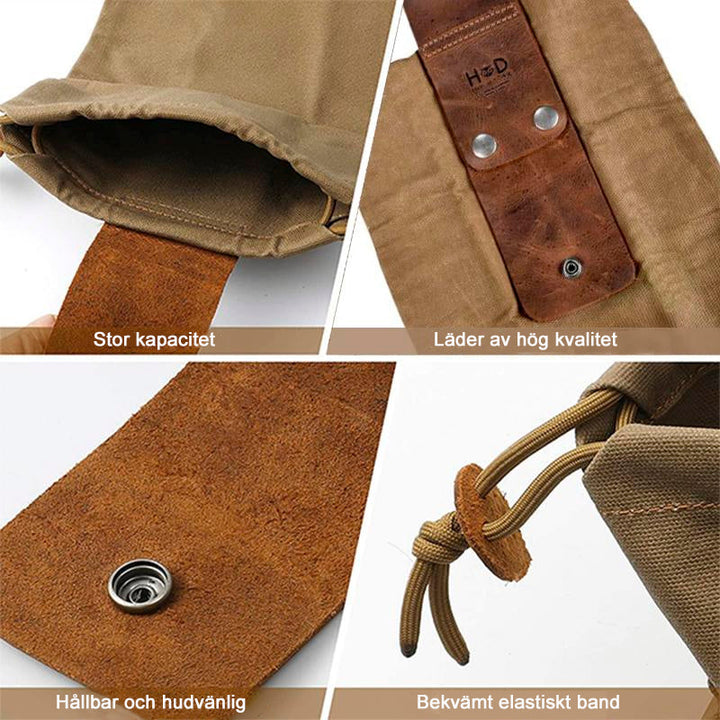 "Unisex vintage läder och canvas foraging påse med stilren design, rymlig, bärbar med bältesögla, brun färg."