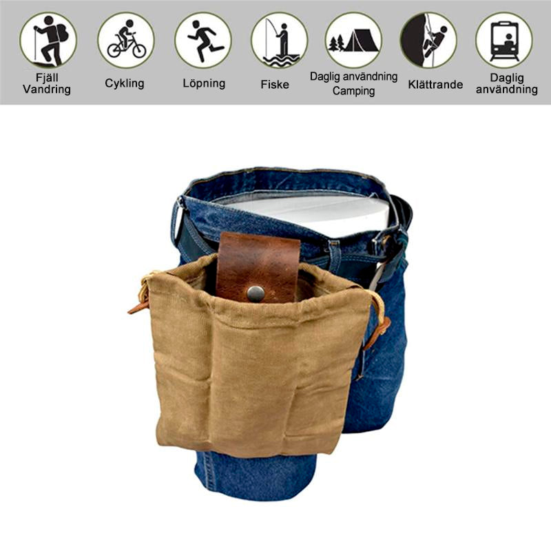 "Unisex vintage läder och canvas foraging påse med stilren design, rymlig, bärbar med bältesögla, brun färg."