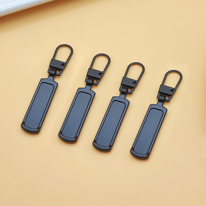 "Universalt avtagbart metallhandtag för dragkedjor, silver, perfekt för kläder och väskor, rektangulärt, robust design."