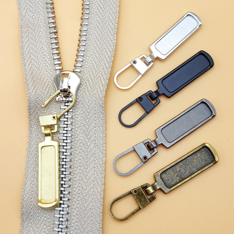"Universalt avtagbart metallhandtag för dragkedjor, silver, perfekt för kläder och väskor, rektangulärt, robust design."