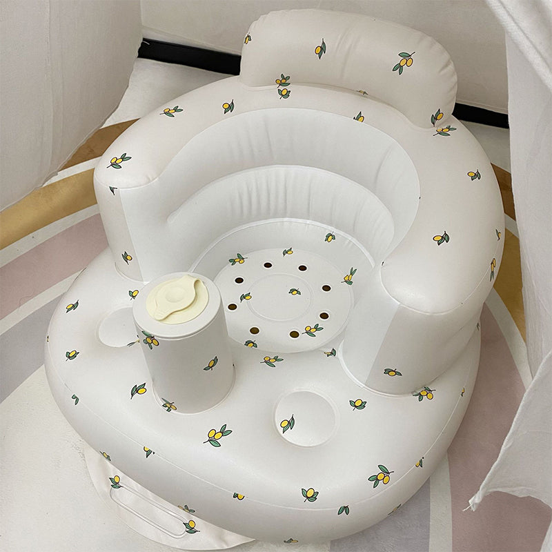 Uppblåsbar babysits med ergonomiskt ryggstöd, i pastellfärger, för barn 3-48 månader, ideal för trygg sittkomfort.