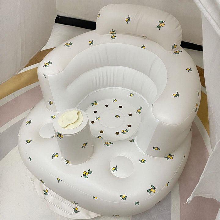 Uppblåsbar babysits med ergonomiskt ryggstöd, i pastellfärger, för barn 3-48 månader, ideal för trygg sittkomfort.