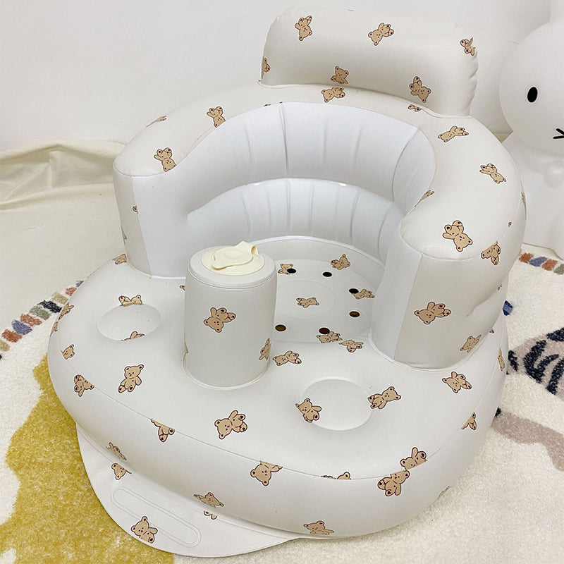 Uppblåsbar babysits med ergonomiskt ryggstöd, i pastellfärger, för barn 3-48 månader, ideal för trygg sittkomfort.