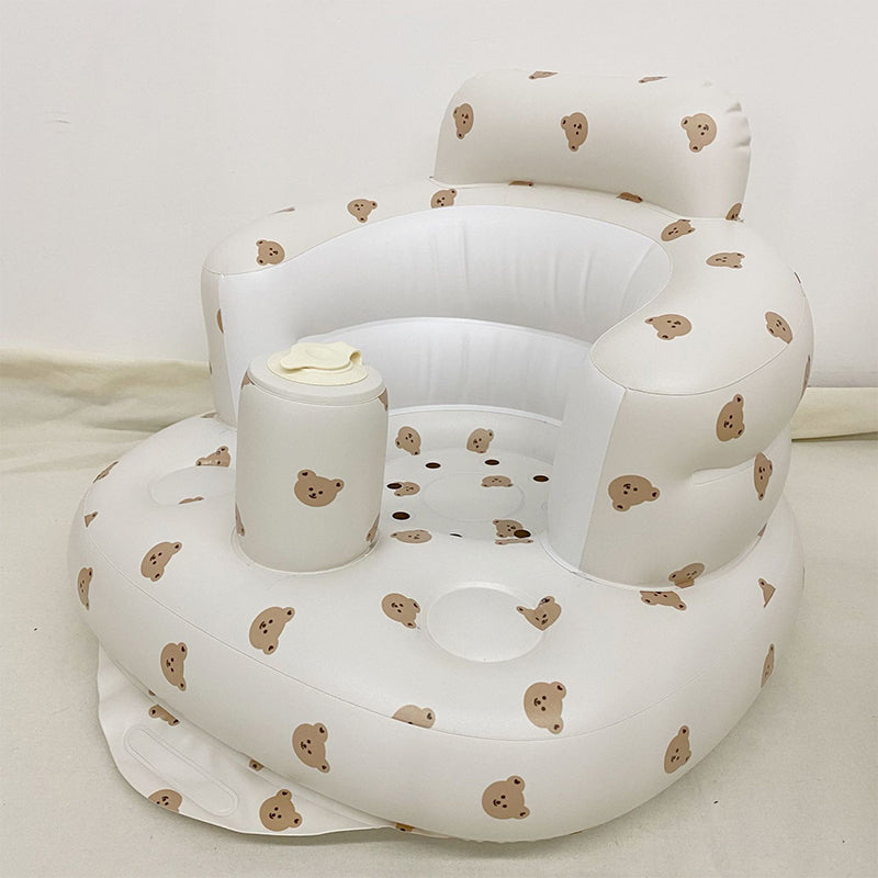 Uppblåsbar babysits med ergonomiskt ryggstöd, i pastellfärger, för barn 3-48 månader, ideal för trygg sittkomfort.