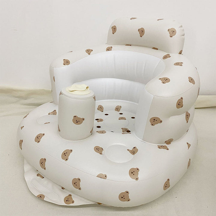 Uppblåsbar babysits med ergonomiskt ryggstöd, i pastellfärger, för barn 3-48 månader, ideal för trygg sittkomfort.
