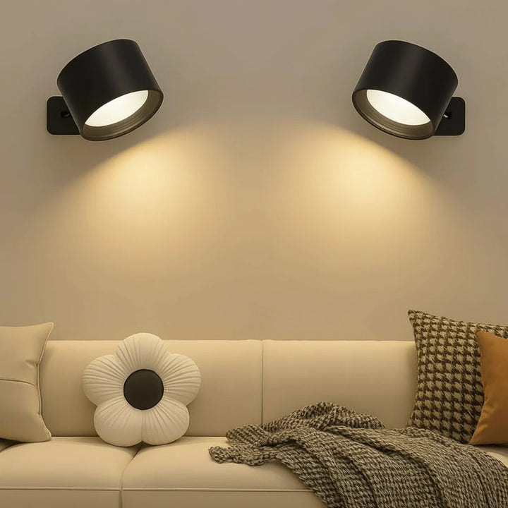 Svart uppladdningsbar LED-vägglampa med magnetfäste i minimalistisk miljö