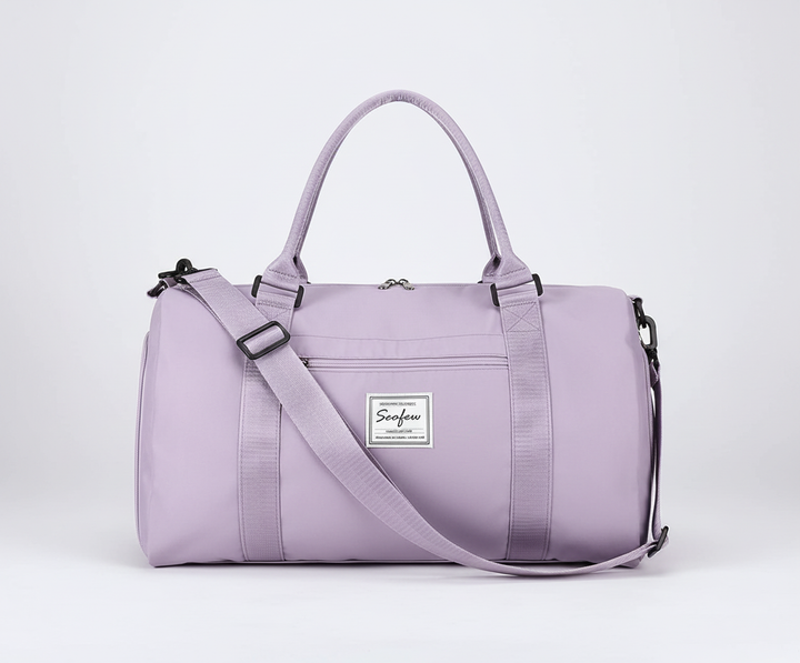 Mångsidig axelväska/duffelbag i vattentätt material för resa. Bekväm att bära, perfekt för dam & herr.