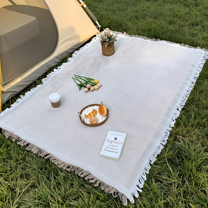 Picknickfilt för trädgården. Vattentät baksida håller dig torr på fuktigt gräs.