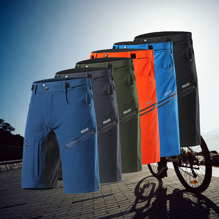 Vattentäta cykelshorts för herrar med justerbar midja, reflexdetaljer och fickor, orange färg