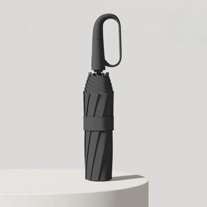 Vindtåligt paraply i svart färg med kompakt hopfällbar design