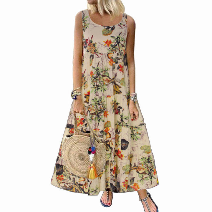 "Vintage damklänning med blommigt mönster, kort och ärmlös, bohemisk stil i blå och rosa toner, perfekt för sommarbruk."