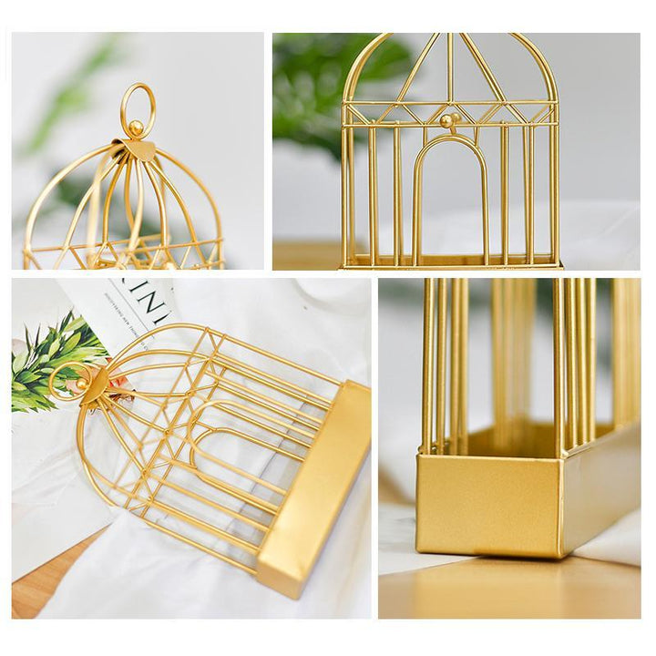 "Vintage myggspolehållare i smidesjärn, fågelbur design, elegant heminredning i gyllene och svart nyans."