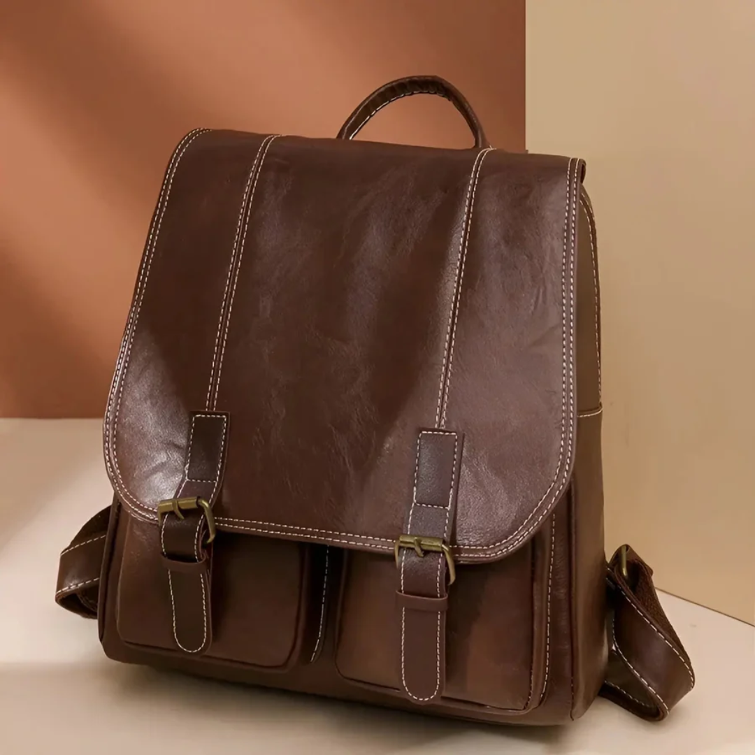 Vintage unisex ryggsäck i brun färg, stilren och funktionell för dagligt bruk som skolväska eller arbetsväska.