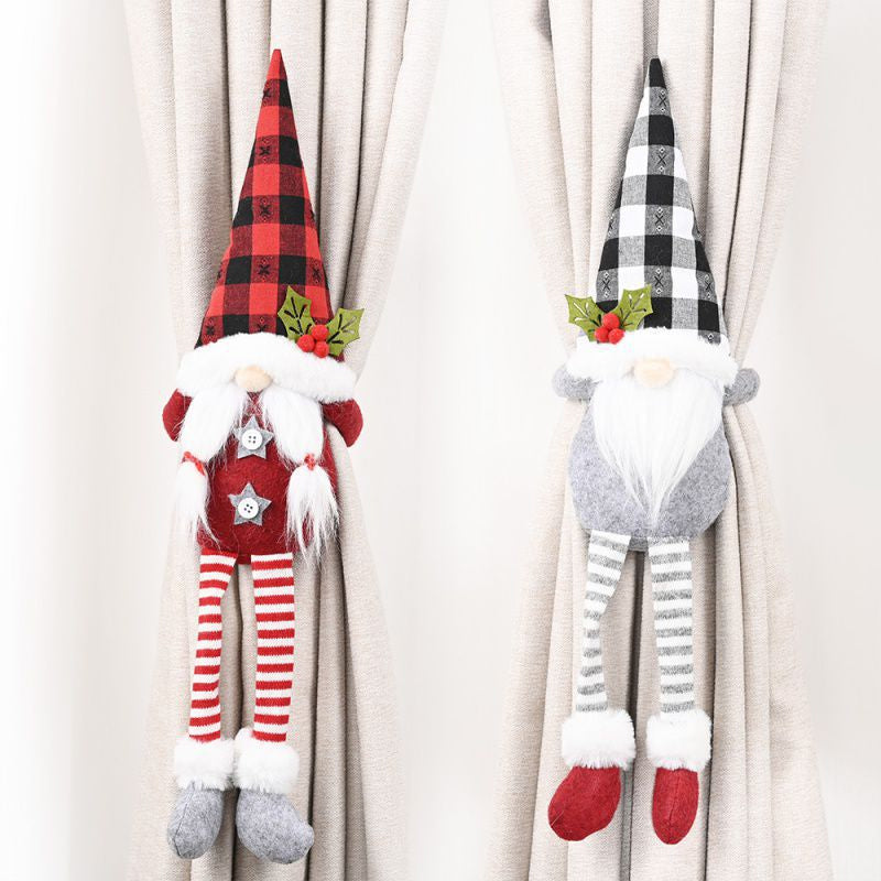 Julgardinspännen med tomte och snögubbe