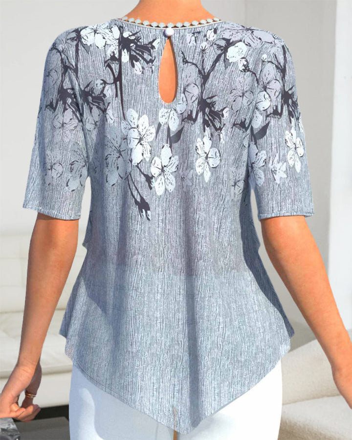 Blus med rund hals i blommönster med kort ärm